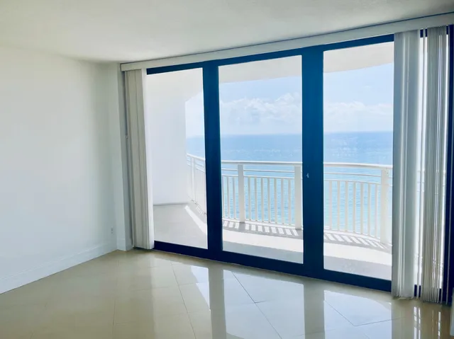 a view of front door with wooden floor