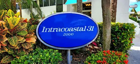 a view of a back yard with table and chairs