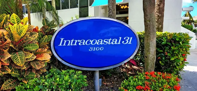 a view of a back yard with table and chairs