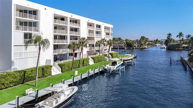 a view of a chairs and table in patio with a yard