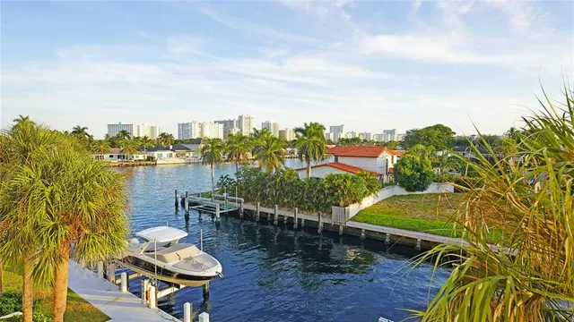 a view of a lake with couches in the patio