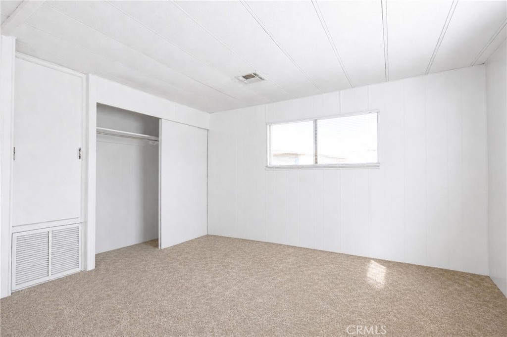 9391 California Avenue, Unit 35 Riverside, CA 92503 - Photo 17 of 32 a view of an empty room with a window