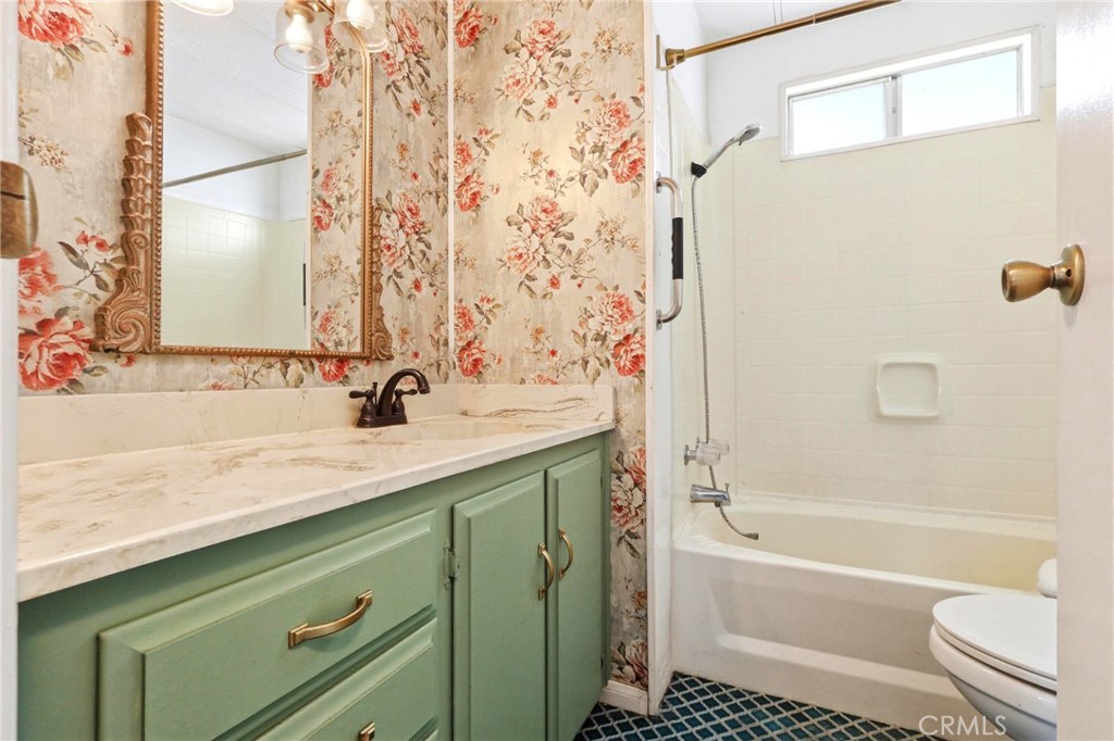 9391 California Avenue, Unit 35 Riverside, CA 92503 - Photo 18 of 32 a bathroom with a sink and a mirror