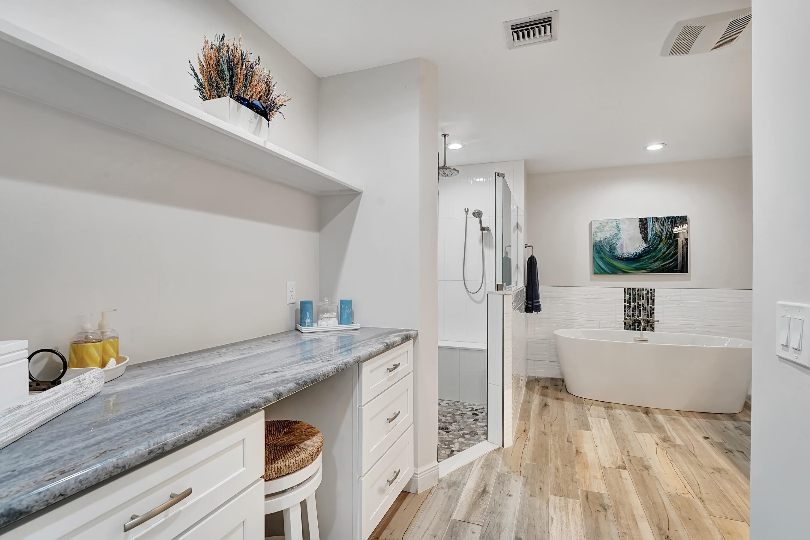 118 Ridge Road Jupiter, FL 33477 - Photo 17 of 27 a spacious bathroom with a granite countertop sink and a mirror
