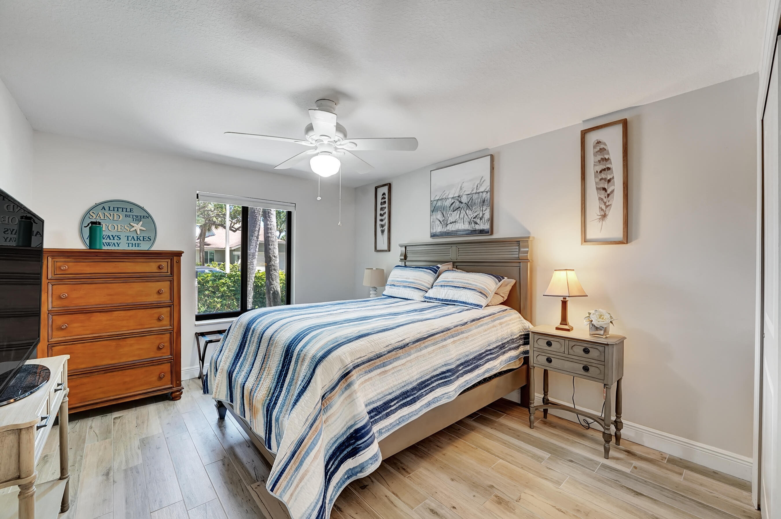 118 Ridge Road Jupiter, FL 33477 - Photo 21 of 27 a bedroom with a bed and a dresser