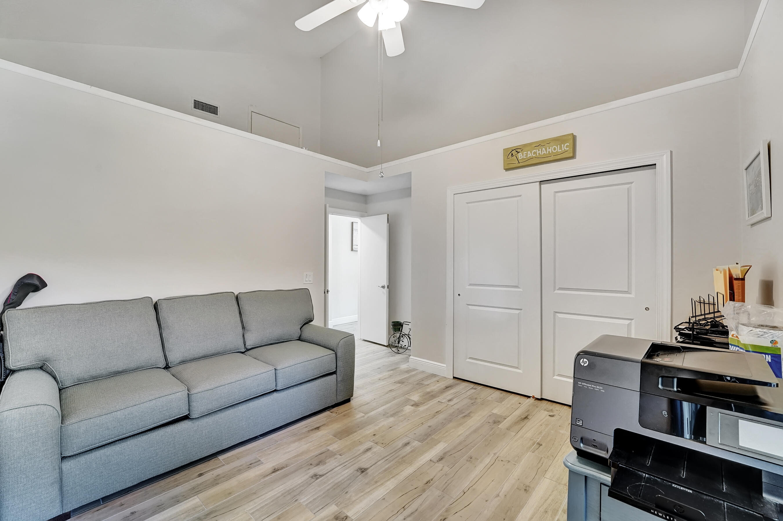 118 Ridge Road Jupiter, FL 33477 - Photo 24 of 27 a living room with furniture and a wooden floor