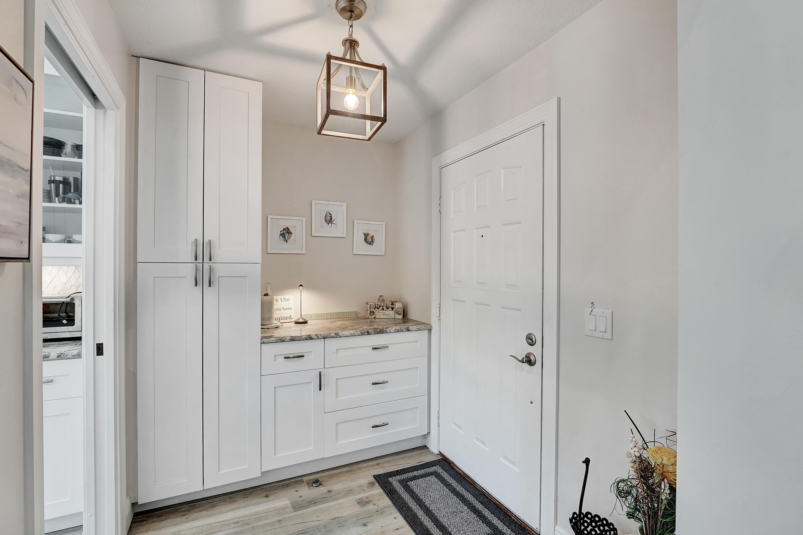 118 Ridge Road Jupiter, FL 33477 - Photo 4 of 27 a bathroom with a granite countertop sink a mirror and a shower