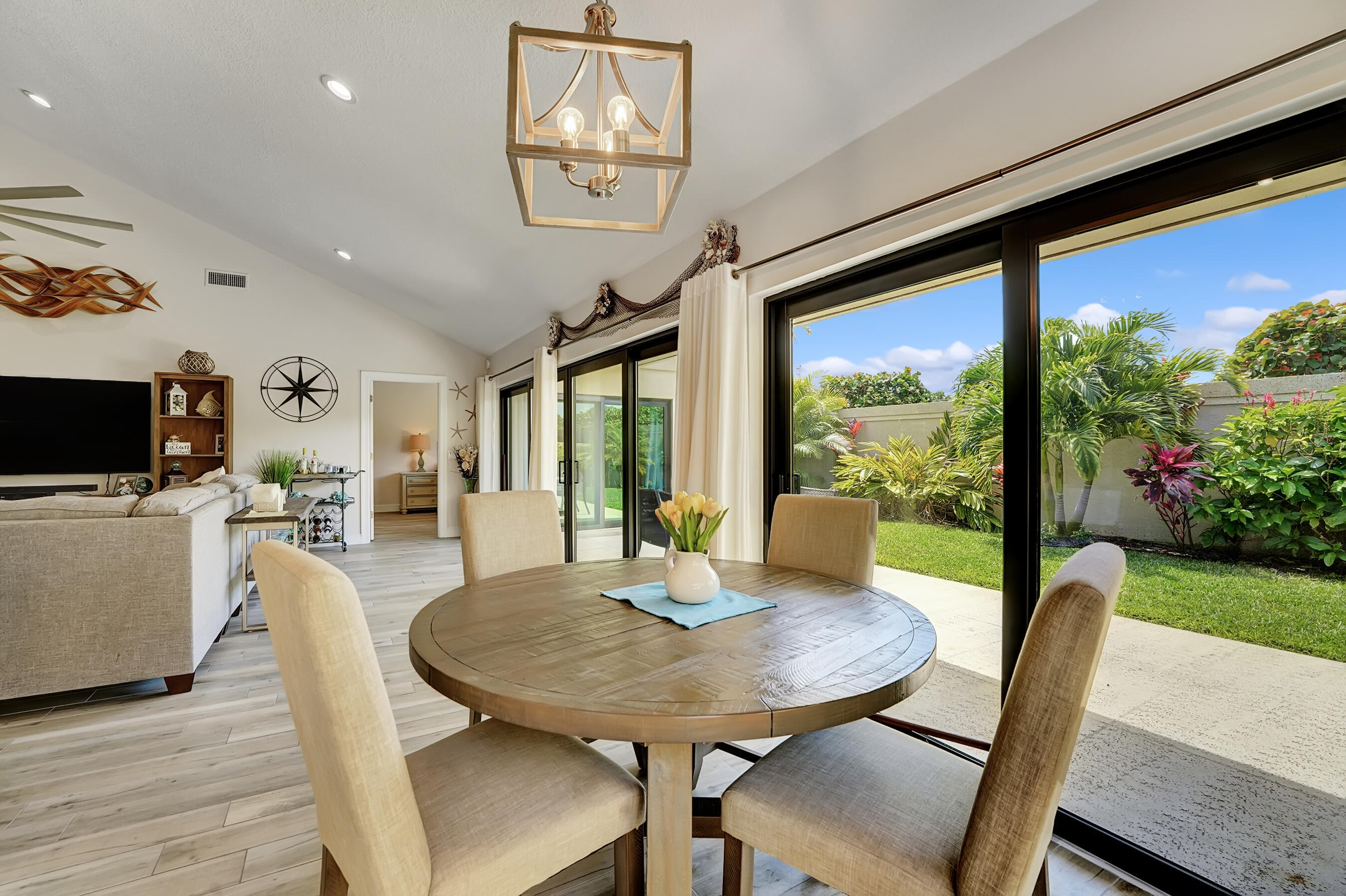 118 Ridge Road Jupiter, FL 33477 - Photo 9 of 27 a view of a dining room with furniture window and wooden floor