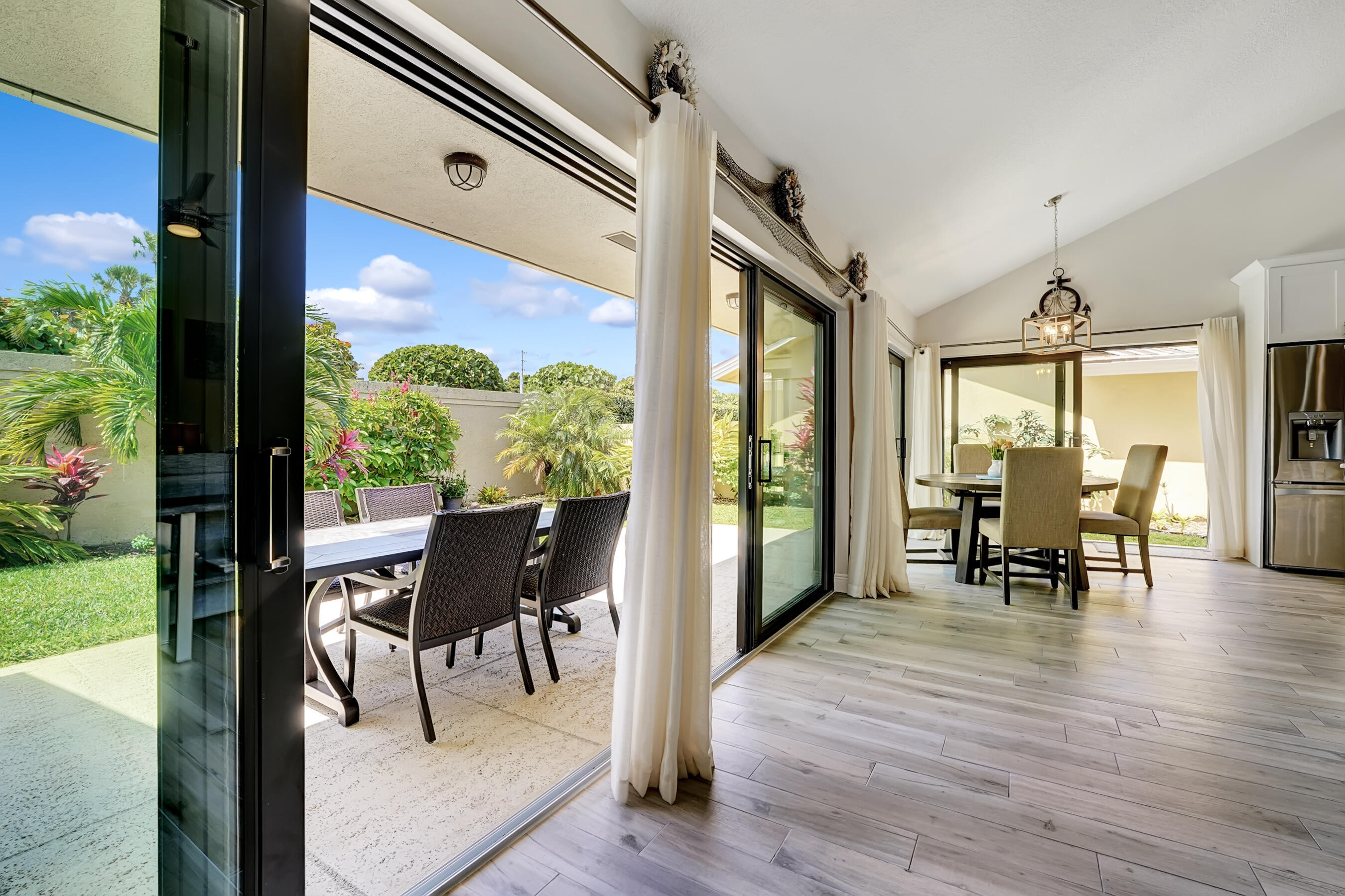 118 Ridge Road Jupiter, FL 33477 - Photo 10 of 27 a view of a dining room with furniture window and wooden floor
