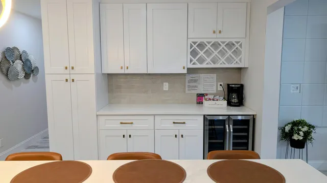 a living room with furniture a potted plant and a fireplace