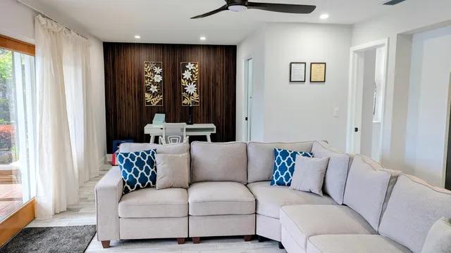 a living room with furniture and a large window