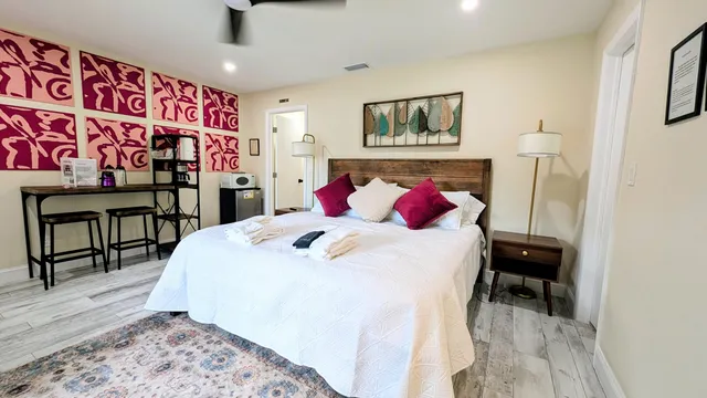 a bedroom with a bed and a table in it