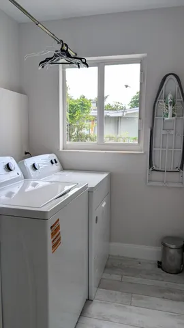 a utility room with washer and dryer