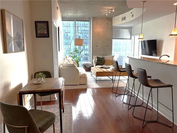 a living room with furniture and a flat screen tv