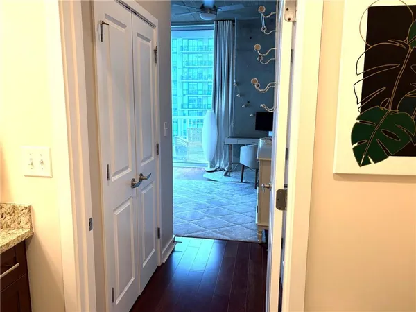 a bathroom with a granite countertop shower and a sink