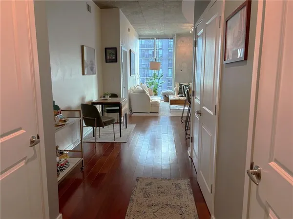 a view of a living room and dining room