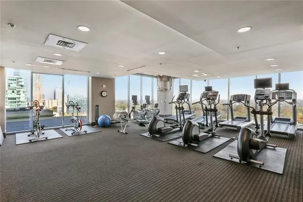 a view of a swimming pool with outdoor seating