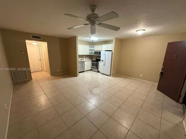 a view of a livingroom with a furniture and a ceiling fan