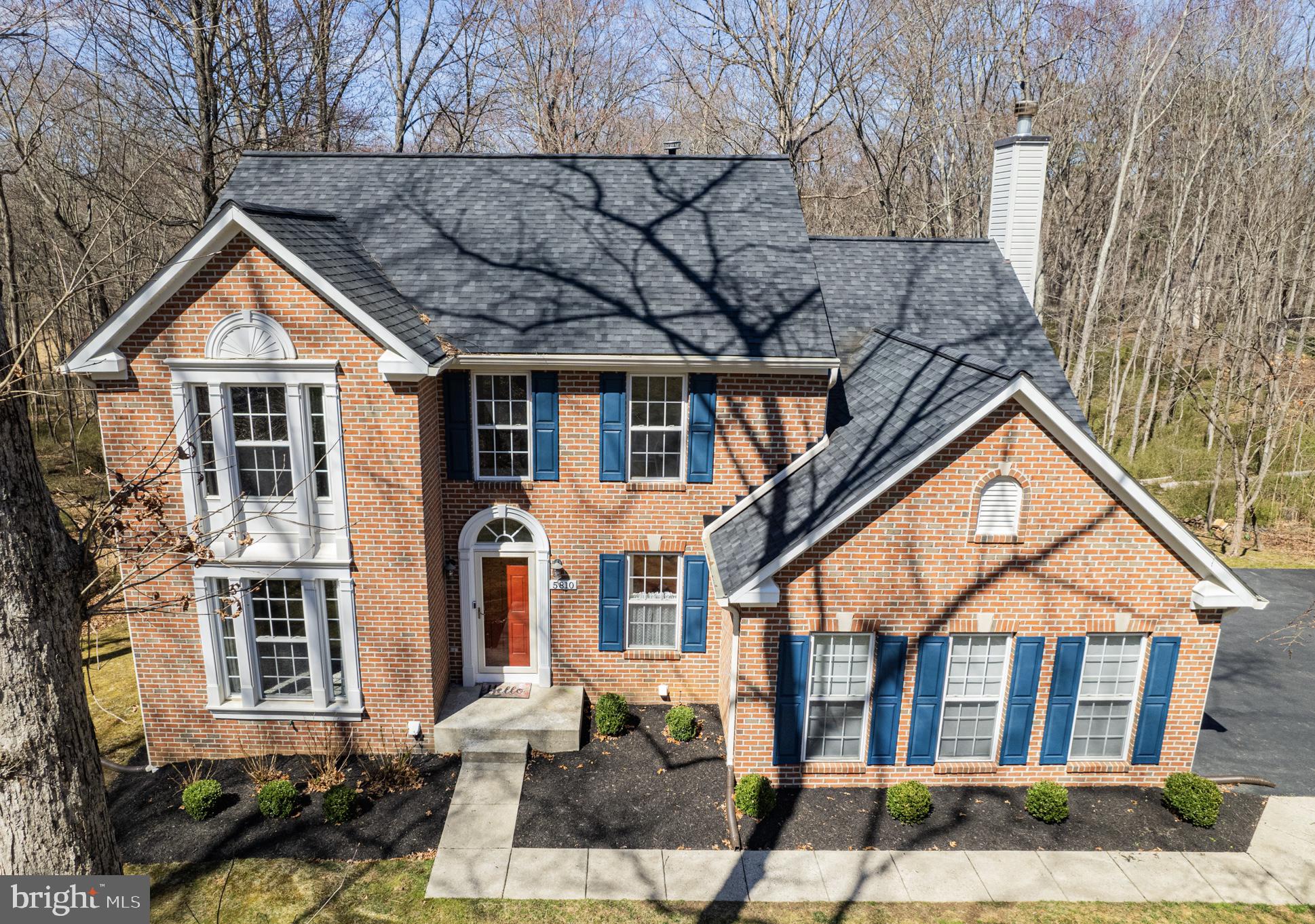 5810 Artisan Drive Eldersburg, MD 21784 - Photo 1 of 39 a front view of a house with garden