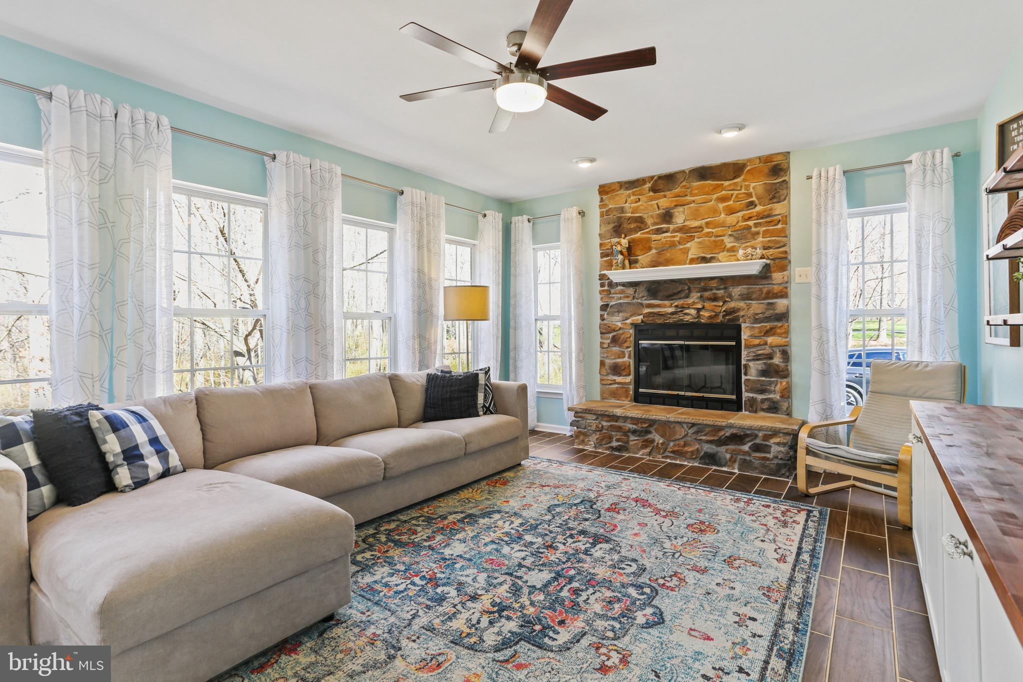 5810 Artisan Drive Eldersburg, MD 21784 - Photo 11 of 39 a living room with furniture windows and a fireplace