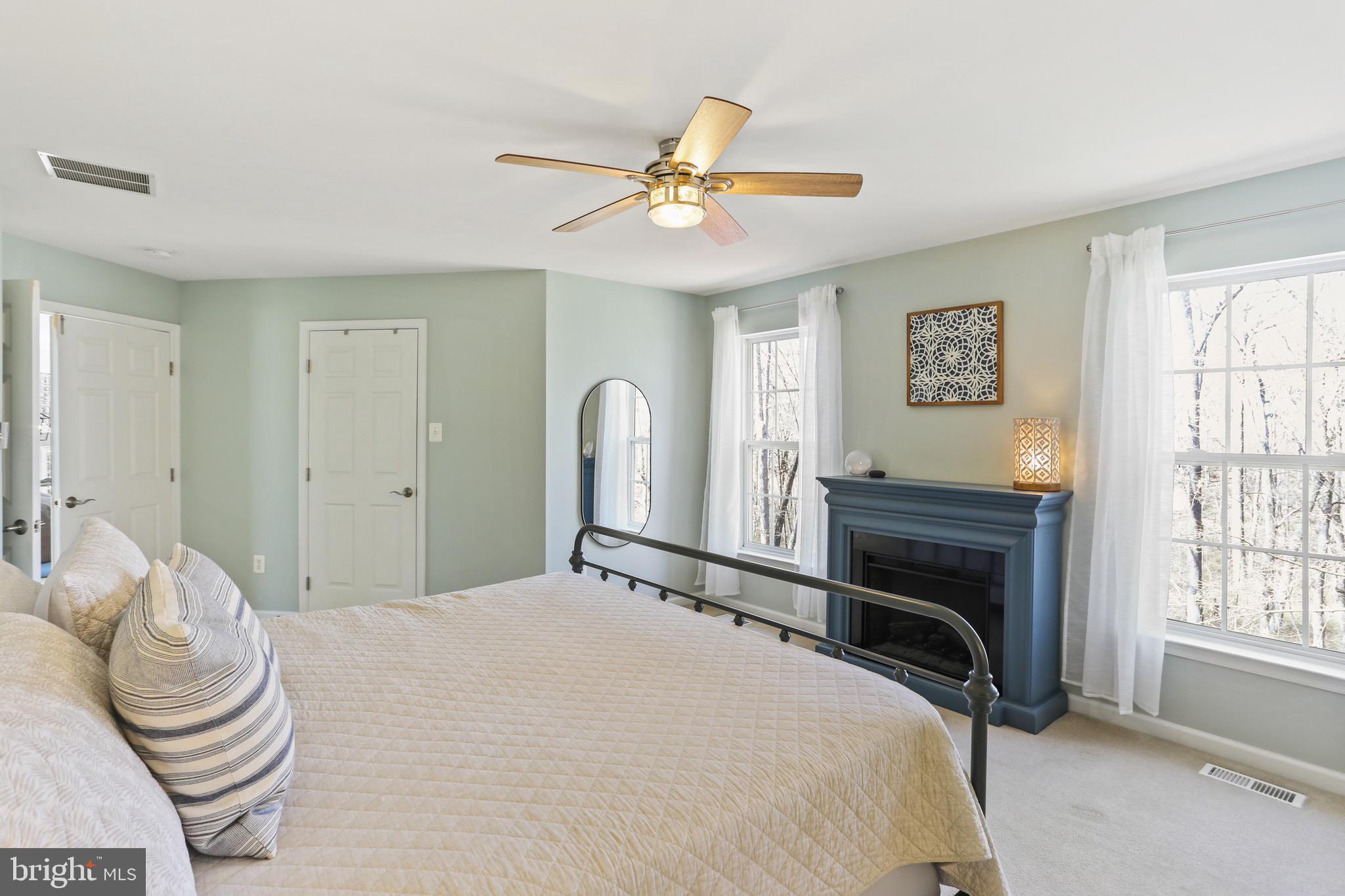 5810 Artisan Drive Eldersburg, MD 21784 - Photo 17 of 39 a bedroom with a bed and a chandelier
