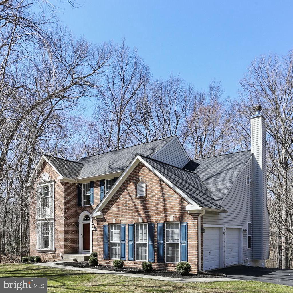 5810 Artisan Drive Eldersburg, MD 21784 - Photo 2 of 39 a front view of a house with a yard