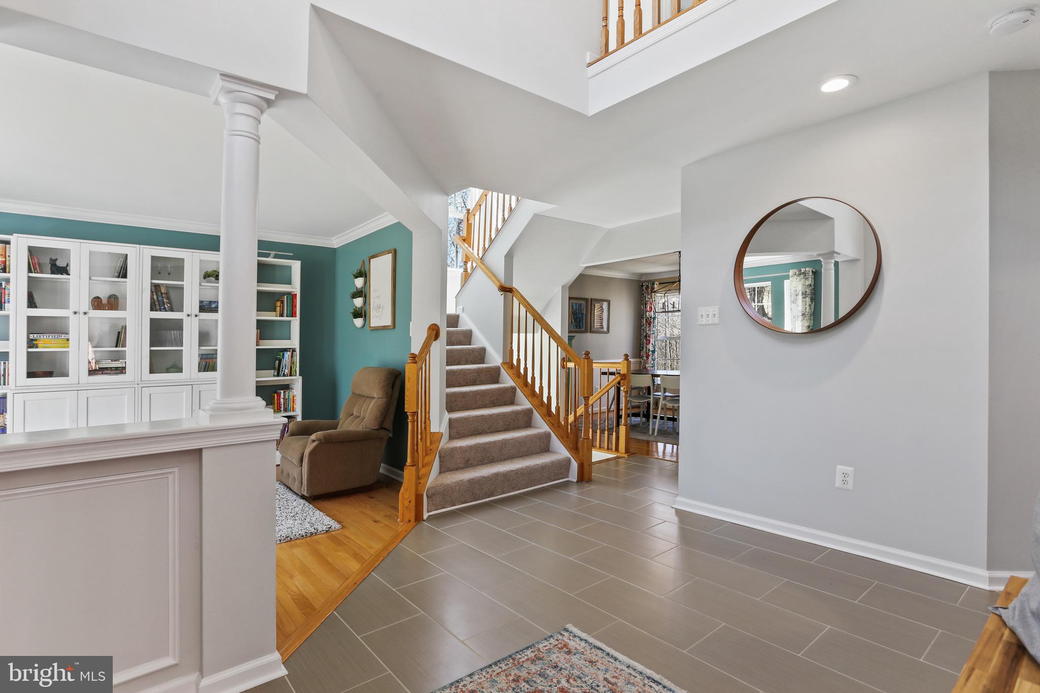 5810 Artisan Drive Eldersburg, MD 21784 - Photo 3 of 39 a view of a livingroom with furniture and stairs