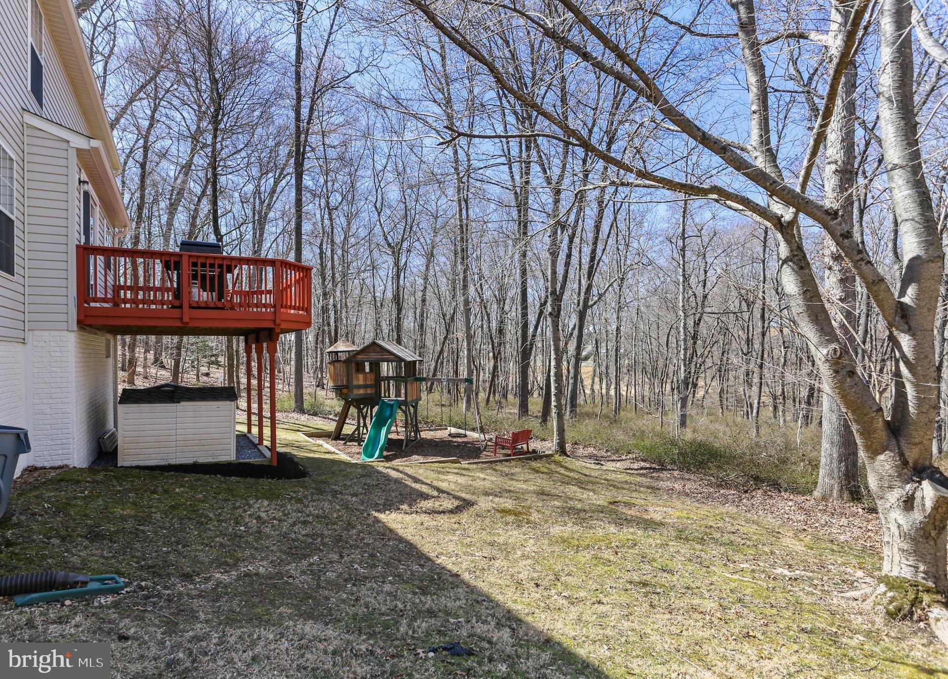 5810 Artisan Drive Eldersburg, MD 21784 - Photo 33 of 39 a view of a house with a yard and large tree