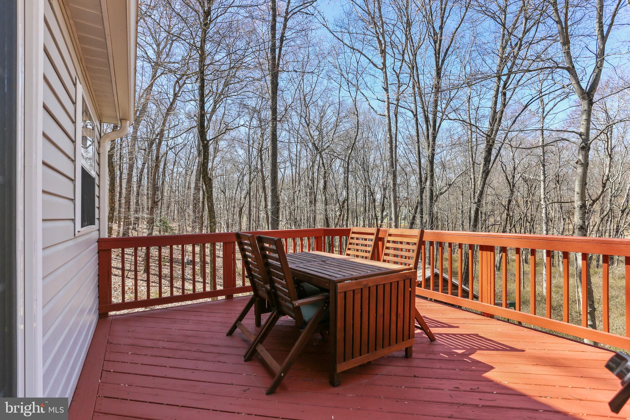 5810 Artisan Drive Eldersburg, MD 21784 - Photo 7 of 39 a view of a wooden chairs and bench on the wooden floor