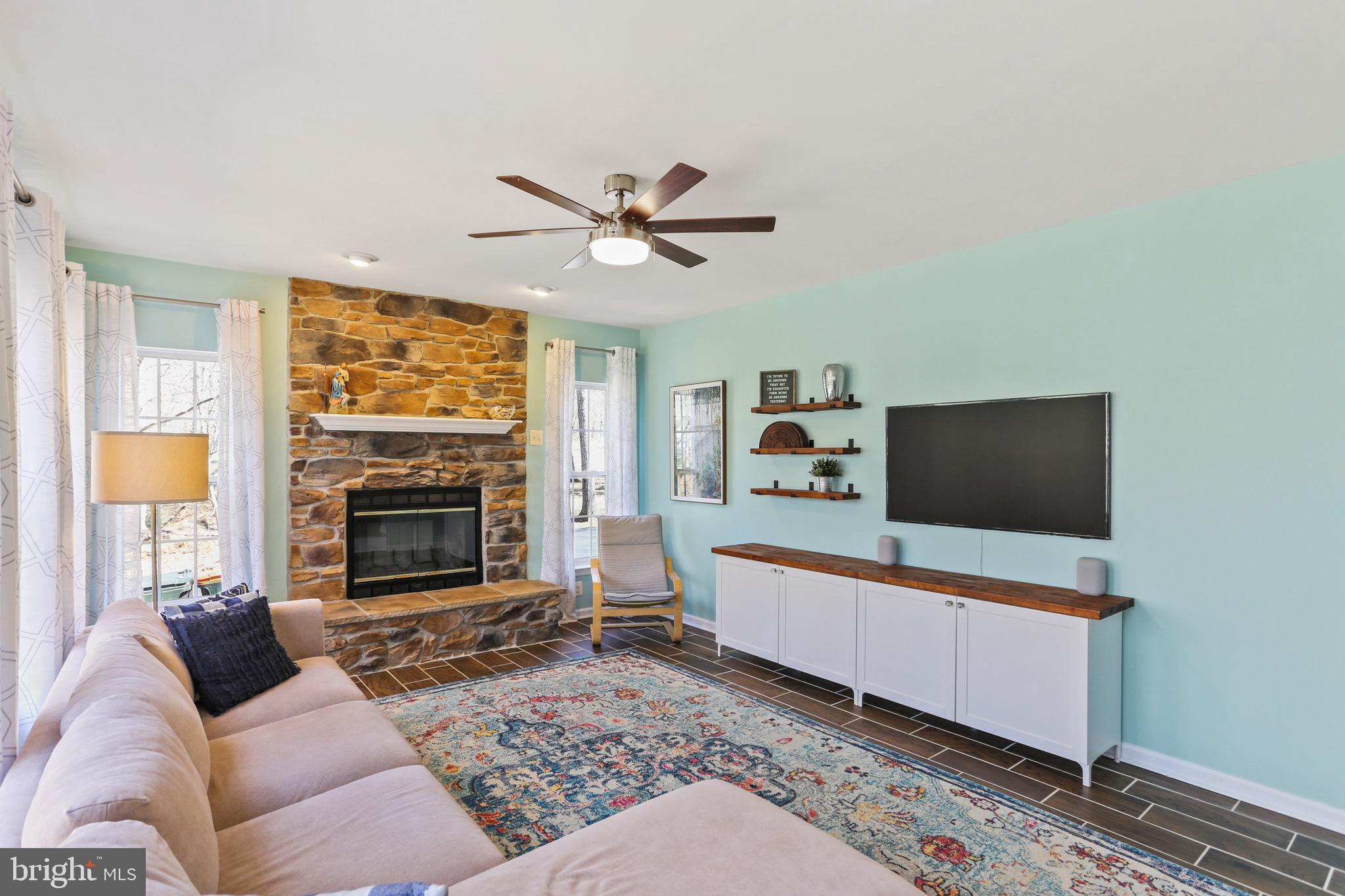 5810 Artisan Drive Eldersburg, MD 21784 - Photo 9 of 39 a living room with furniture and a flat screen tv
