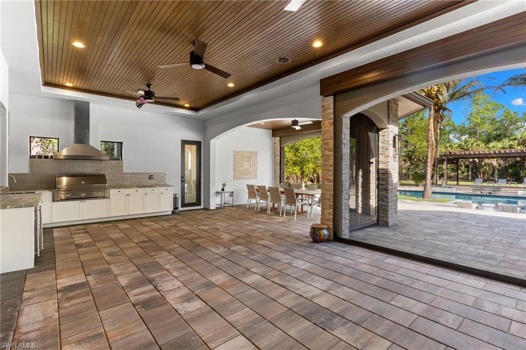 4501 3rd Avenue Southwest Naples, FL 34119 - Photo 39 of 50 Screened patio with summer kitchen