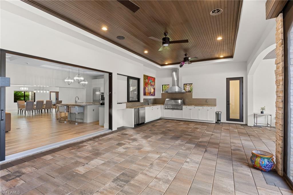 4501 3rd Avenue Southwest Naples, FL 34119 - Photo 40 of 50 Screened patio with summer kitchen