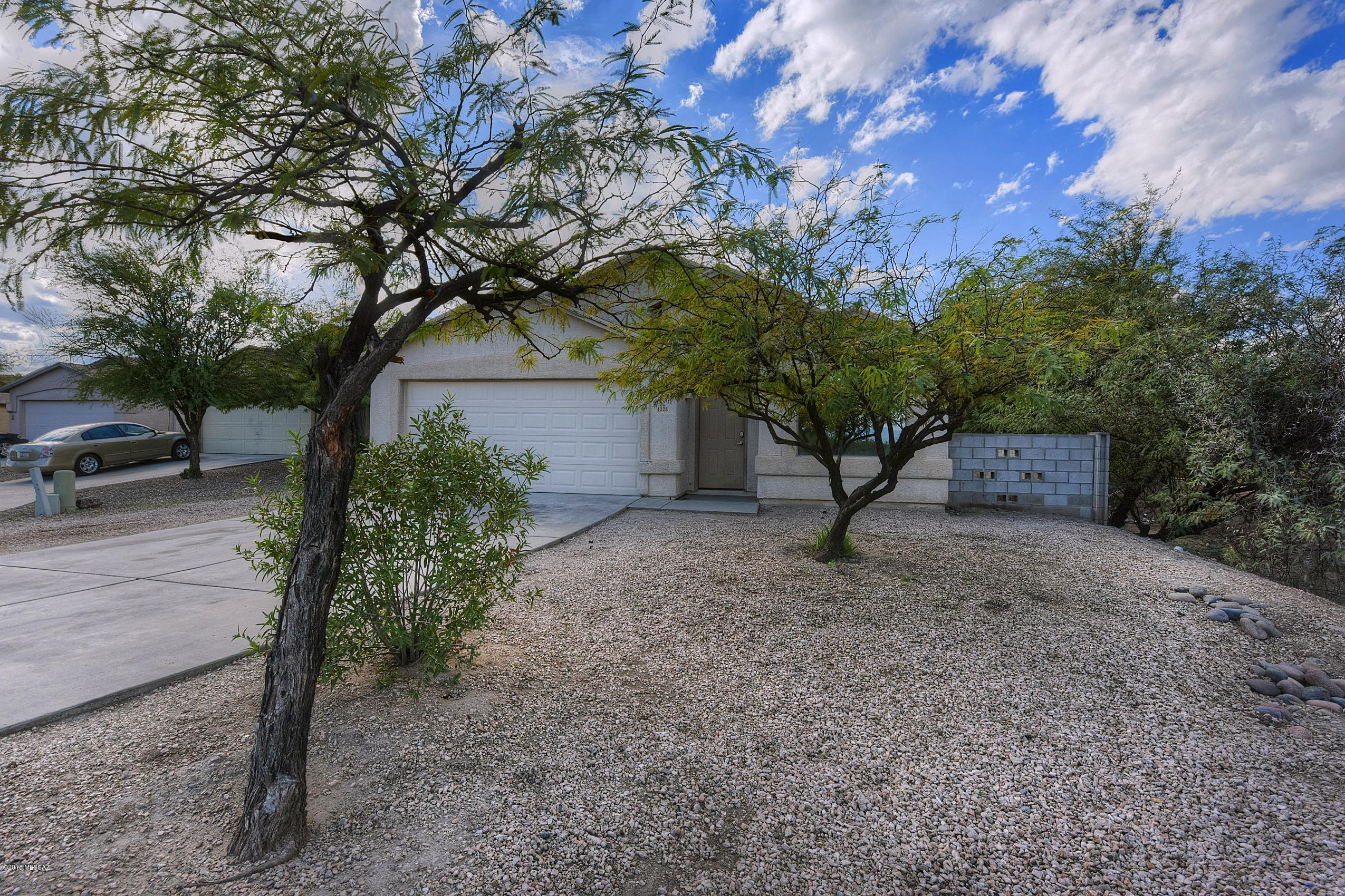 4328 South Valley Road Tucson, AZ 85714 - Photo 2 of 29 a view of a house with a tree