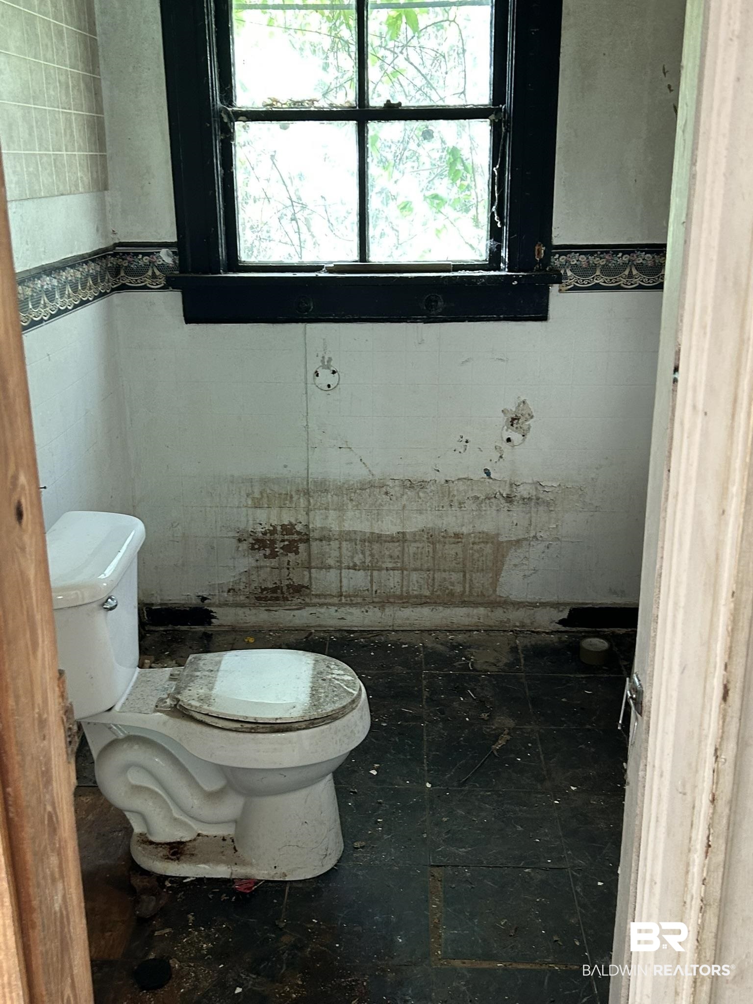 3142 West Turner Road Mobile, AL 36612 - Photo 14 of 19 Bathroom featuring toilet and tile walls