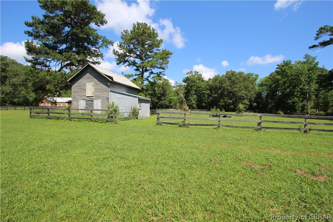 1247 Gdn Crk Road Mathews, VA 23109 - Photo 9 of 49 a view of a house with a backyard