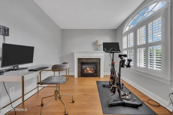 a living room with furniture flat screen tv and a fireplace