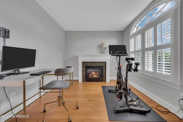 a living room with furniture flat screen tv and a fireplace