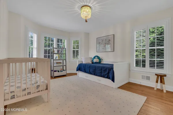 a bedroom with furniture and a window