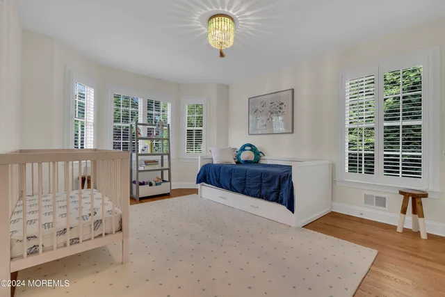 a bedroom with furniture and a window