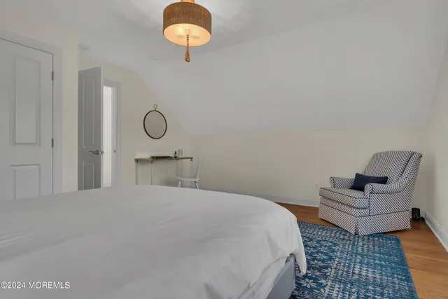 a bedroom with a bed and couch