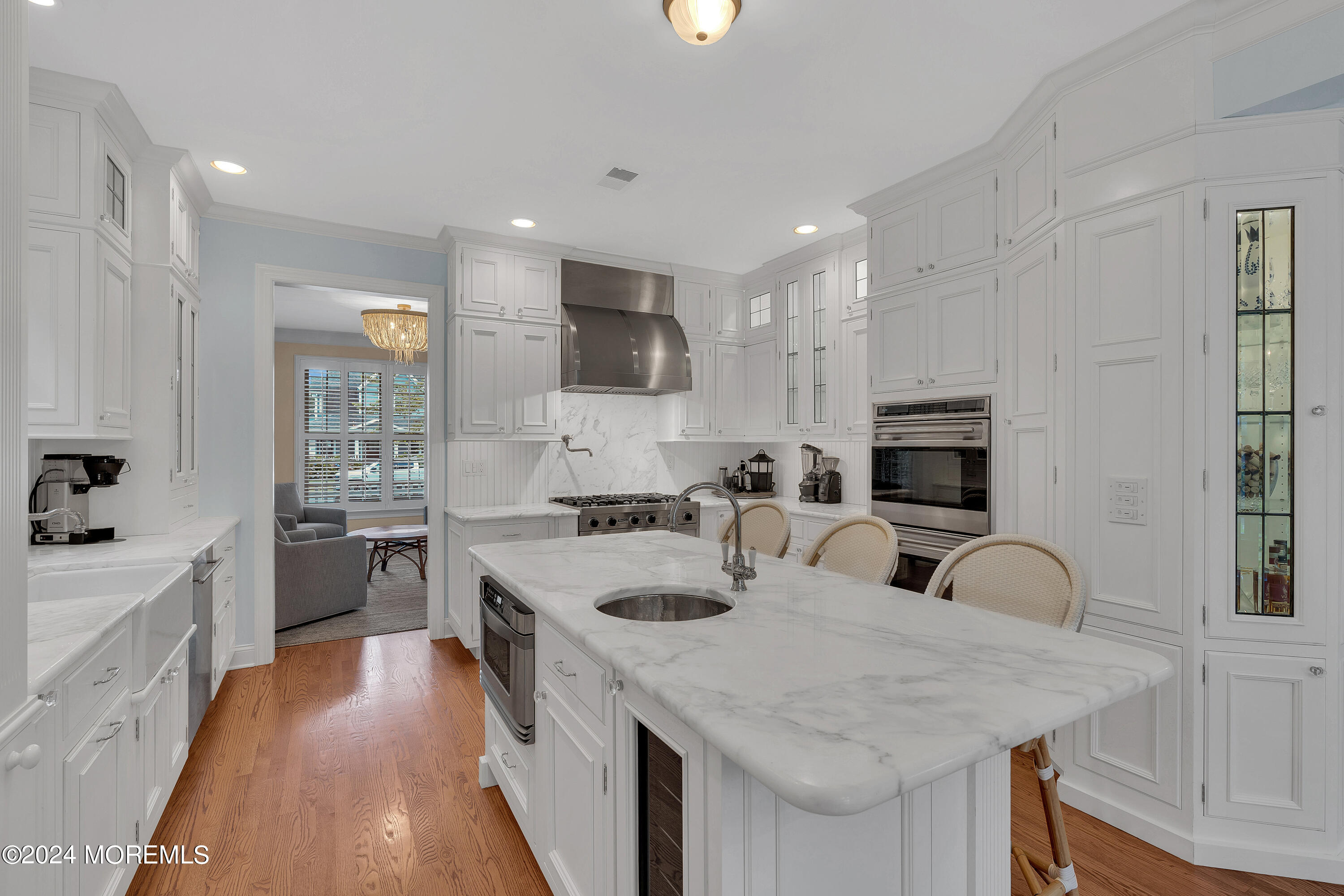 314 Jersey Avenue Spring Lake, NJ 07762 - Photo 8 of 33 a view of a kitchen counter space a sink wooden floor and stainless steel appliances