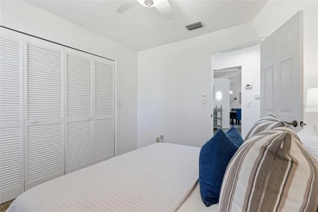 a front view of a house with a garden and trees