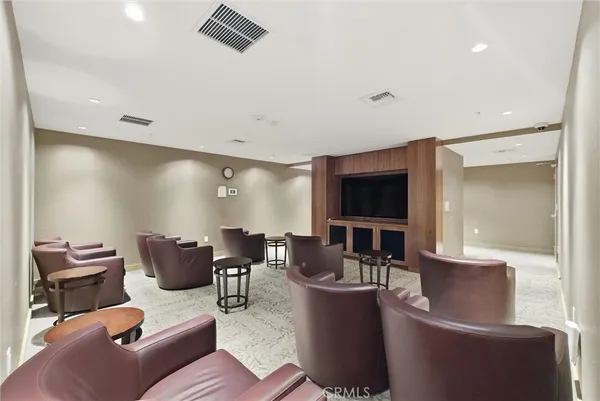 a living room with furniture a table and chairs