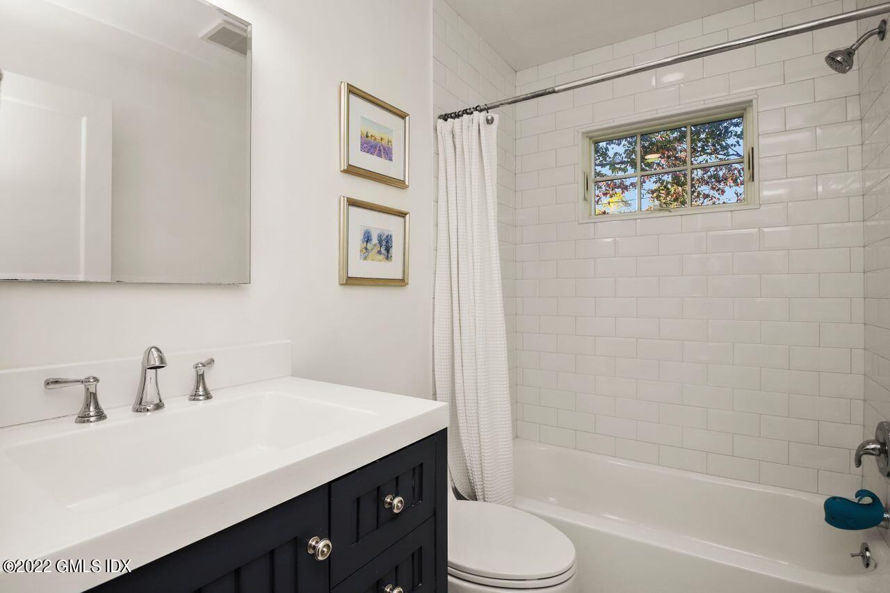 6 Ernel Drive Riverside, CT 06878 - Photo 11 of 26 a bathroom with a sink a toilet and shower