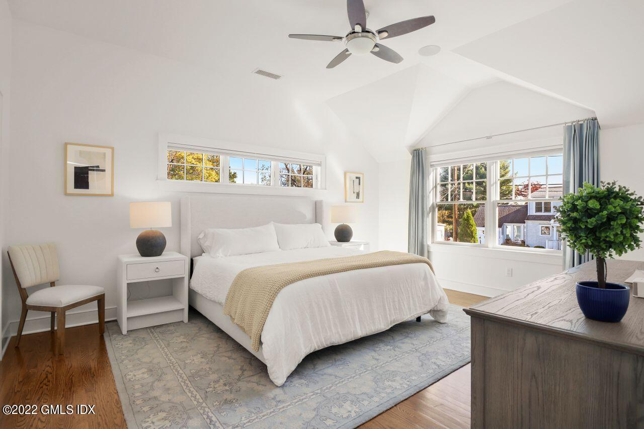 6 Ernel Drive Riverside, CT 06878 - Photo 12 of 26 a bedroom with a bed and a potted plant