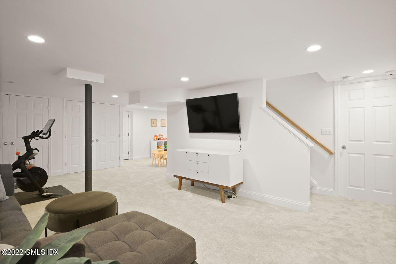 6 Ernel Drive Riverside, CT 06878 - Photo 18 of 26 a living room with furniture and a flat screen tv