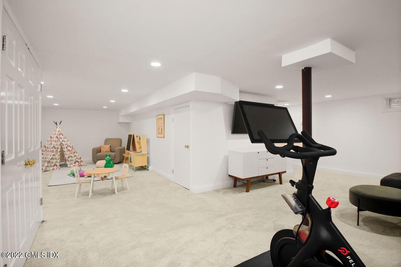 6 Ernel Drive Riverside, CT 06878 - Photo 19 of 26 a living room with furniture and a chandelier