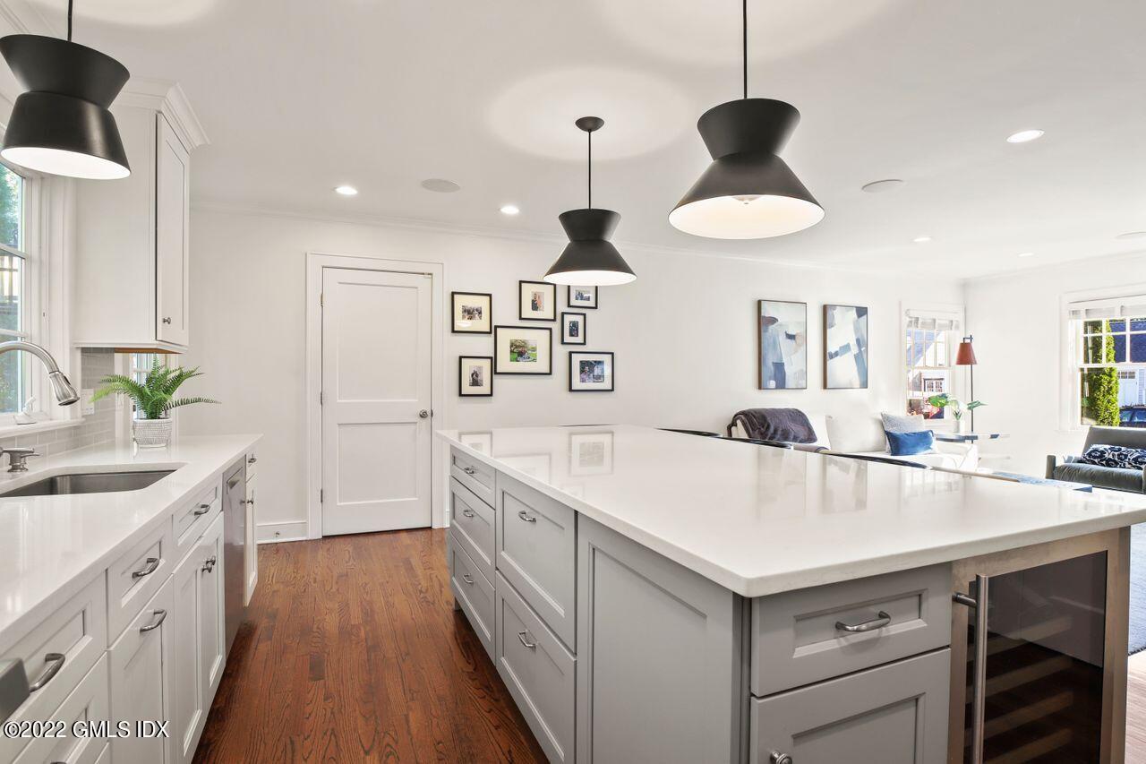 6 Ernel Drive Riverside, CT 06878 - Photo 7 of 26 a kitchen with a sink a center island and stainless steel appliances