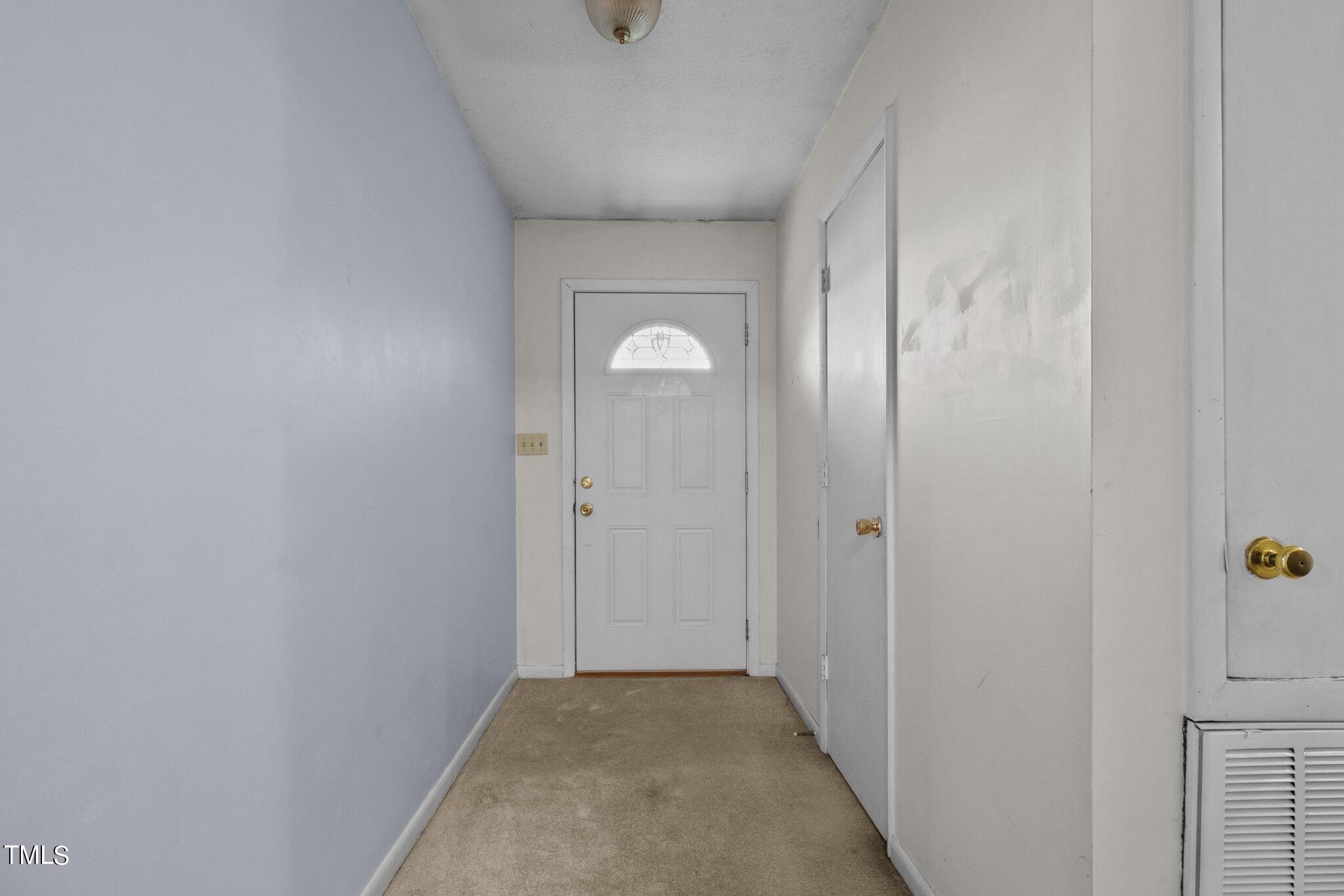 4998 Stewart Road Wade, NC 28395 - Photo 5 of 38 a view of a hallway with wooden floor