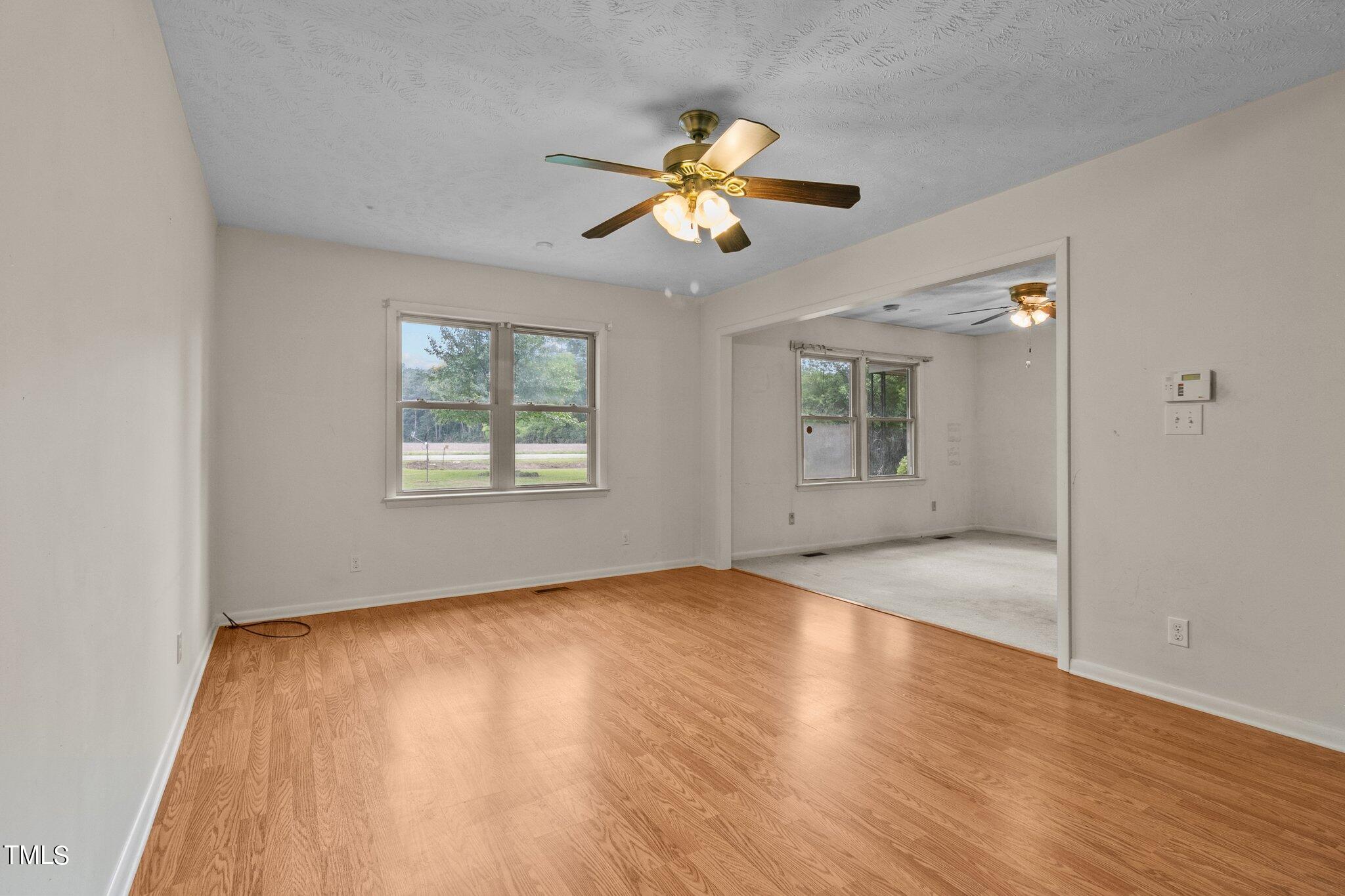 4998 Stewart Road Wade, NC 28395 - Photo 8 of 38 wooden floor in an empty room with a window